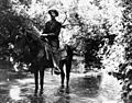 Ed Hunt crossing the L.A. River on horse in 1911 (00008087)