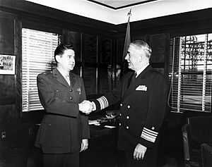 LtCol Leo J. Dulacki receives Bronze Star from VADM Robert P. Briscoe, 1953