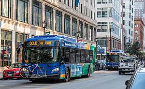Milwaukee County Transit buses 5523 and 5104 eastbound on W. Wisconsin Ave (2018)