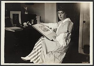 Nina E Allender at desk