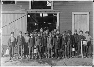 5 pm. Boys going home from Monougal Glass Works. A native remark, "De place is lousey wid kids." Fairmont, W. Va. - NARA - 523094