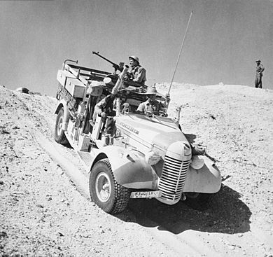 A Long Range Desert Group Chevrolet 30cwt 1533 truck negotiates the slope of a sand dune during a patrol in the desert, 27 March 1941. E2298