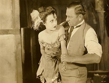Bessie Love and Wallace Beery in scene from Dynamite Smith (1924)