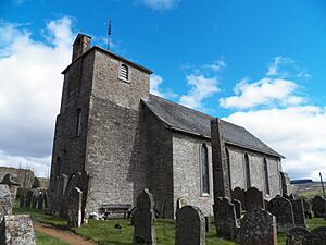 Bewcastle cross and church.jpg