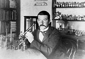 C. J. Pound pictured with his microscope