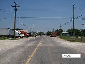 In front of Mark Street on FM 2210, looking east