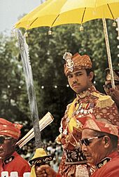 The Crown Prince being borne by the "Usungan", or Royal coach, to his Coronation on 1 August 1968.