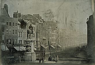 View of Whitehall from Trafalgar Square which is blurred with pedestrian and carriage traffic, London, 1839
