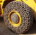 Traction chains on a wheel loader - cropped