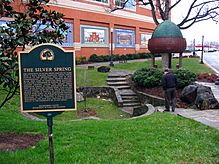 A photo of a commemorative plaque inscribed with the details of the founding of Silver Spring.
