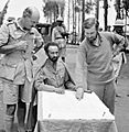 Haile Selassie, Emperor of Abyssinia, with Brigadier Daniel Arthur Sandford (left) and Colonel Wingate (right) in Dambacha Fort, after it had been captured, 15 April 1941. E2462