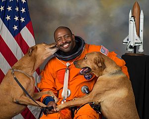 NASA astronaut Leland D. Melvin with his dogs Jake and Scout