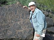 Phoenix-Deer Valley Rock Art Center-Tony posing by Petroglyph - 2