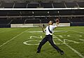 President Barack Obama throws a football