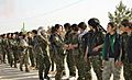 YPJ fighters shake hands with one another
