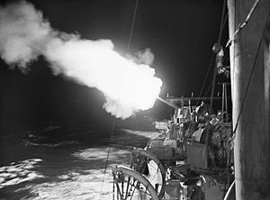 A 4.7-inch gun onboard HMS JUPITER firing on enemy shipping in the port of Cherbourg, on the night of 10-11 October 1940. A1010