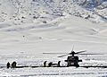 Afghan police and coalition special operations forces load a police member needing medical care onto an MH-60 Black Hawk helicopter during a medical evacuation in the Shah Joy district in Afghanistan's Zabul 120127-N-CI175-134