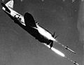 Republic P-47D-40-RE in flight firing rockets