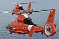 Two coast guard HH-65C Dolphin helicopters