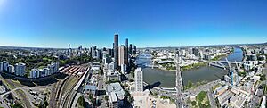 Aerial panorama of Brisbane city and its train station, and Brisbane River