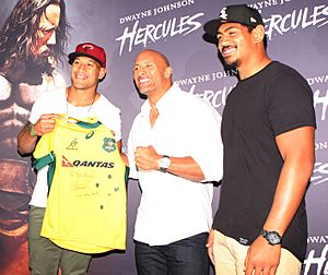 Israel Folau and Will Skelton present Johnson a signed Wallabies jersey 2014