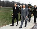 Meeting with President Eisenhower. President Kennedy, President Eisenhower, military aides. Camp David, MD. - NARA - 194198
