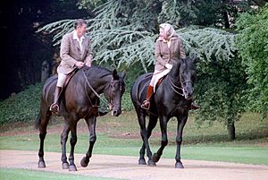 President Ronald Reagan riding horses with Queen Elizabeth II during visit to Windsor Castle