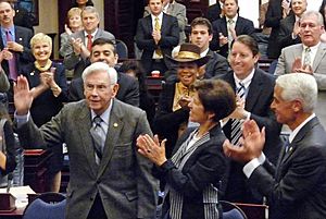 Reubin Askew acknowledges applause by lawmakers at the opening of a joint session of the Legislature