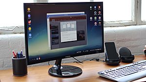Samsung DeX dock with S8, plugged into monitor