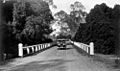 StateLibQld 1 132320 Austin motor vehicle crossing a bridge at Burpengary, 1934