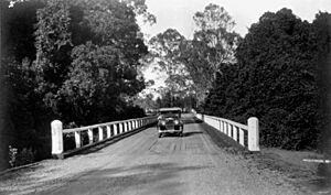 StateLibQld 1 132320 Austin motor vehicle crossing a bridge at Burpengary, 1934