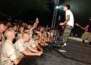 US Navy 030825-N-6803B-001 The rock band Blink-182 guitarist and singer Tom Delonge performs for Sailors and Marines at Naval Support Activity Bahrain's Main Street Park