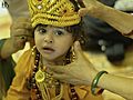 A Hindu baby being dressed up as Krishna for the Janmashtami festival