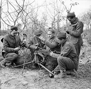 Men of the 2-7th Middlesex Regiment carry out maintenance on a Vickers machine gun at Anzio, Italy, 21 February 1944. NA12114