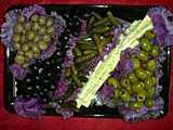 Olives attractively served in purple cabbage leaves