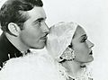 Press photo of John Boles and Gloria Swanson in Music in the Air (front) (cropped)