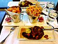 Steak meal with fries and tater tots