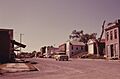 VIEW OF THE MAIN STREET OF WHITE CLOUD, KANSAS, NEAR TROY, IN THE NORTHEAST CORNER OF THE STATE. AT THE EXTREME RIGHT... - NARA - 557155