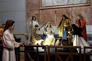 A Catholic nun looks at the nativity scene figures inside the Manila Cathedral-Basilica in Intramuros, Manila on December 7, 2022 (58377)