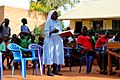 An Ugandan nun teaching during a community service day