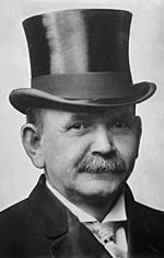 Austin Lane Crothers, photograph of head with top hat.jpg