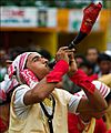 Bihu dancer with a horn