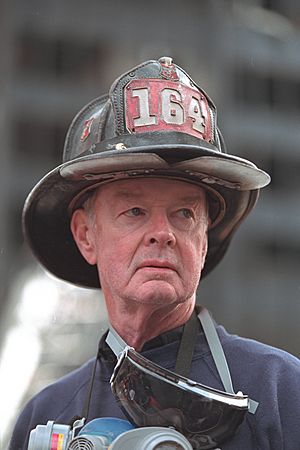 Retired New York City firefighter Bob Beckwith stands at the site of the collapsed World Trade Center in New York City.jpg