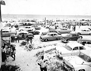 Cars pack the parking area at Butler Beach