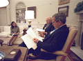 Dina Powell in Oval Office with Bush and Cheney