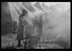 Negro flood refugee washing clothes in the camp at Forrest City, Arkansas LCCN2017728357