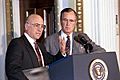 President Bush shares the podium with Secretary Yeutter at a briefing of the National Association of Agricultural Journalists in the Indian Treaty Room of the White House