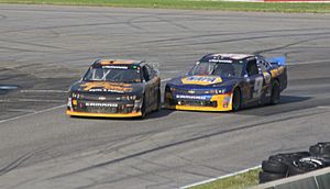 Brendan Gaughan and Chase Elliott battle for win on Turn 5 at Road America