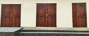 Carved Mahogany doors with Nsibidi script at St. Francis Specialist Mortuary Aba, Nigeria