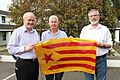 Members of Sinn Féin with a Catalan flag
